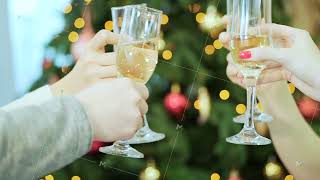 Company is holding glasses with champagne and clink christmas tree on the background Christmas [upl. by Codie658]