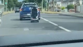 CRAZY mobility scooter fail moment shows man falling off his ride during car turn  WooGlobe [upl. by Sharpe]