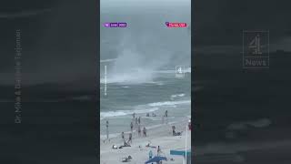 Waterspout causes chaos on Florida beach and injures two [upl. by Ivgnout]