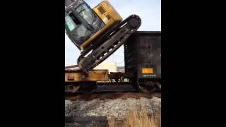 Unloading excavator from rail car [upl. by Ivo747]