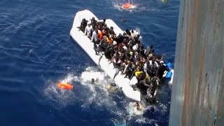 Migrants Flee Sinking Dinghy in Dramatic Footage [upl. by Notnil]