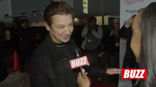 The 92nd Hollywood Christmas Parade Grand Marshall Jeremy Renner talks giving back  BUZZ BITES [upl. by Elocen864]