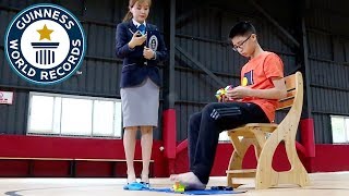 Fastest time to solve 3 Rubiks cubes with hands and feet  Guinness World Records Day 2018 [upl. by Reinhart]