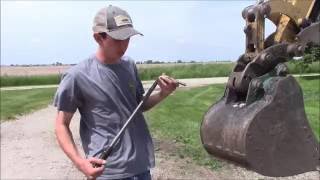 How To Change Buckets with a Caterpillar Mini Excavator Manual Quick Coupler [upl. by Steinberg]