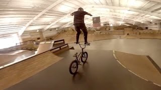 Bicyclist Rides Handlebars Through Skate Park [upl. by Ymrots359]