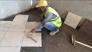 Installing ceramic floor tiles using modern tools [upl. by Taryne501]