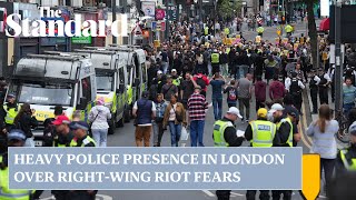 UK riots heavy police presence in London over fears rightwing activity could spark chaos [upl. by Ainecey]