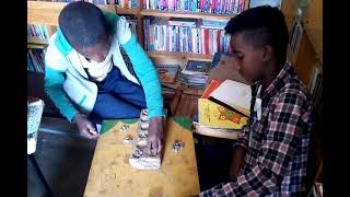 ገበጣ በቤተመጻሕፍት Gebeta an Ethiopian board game [upl. by Ahseinek]