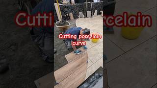 Cutting a curve to transition from 900x600 porcelain tile to 1200x300 wood effect [upl. by Estevan943]