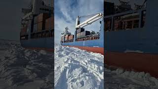 Icebreaker ship towing a container ship [upl. by Tnairb]