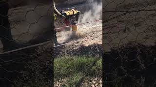 Vibrating rammer plate at a construction site Compaction of soil before laying [upl. by Spoor]