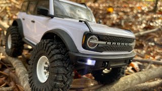 Traxxas Trx4m 3s wbrushless outrunner motor fun trailing over brush and stringy wet pine needles [upl. by Leavy]