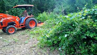 Kubota tractor L4600 with Land pride brush hog [upl. by Eem]