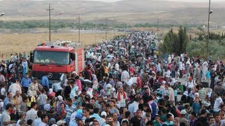 Iraq 30000 Syrian Refugees Cross Border in Six Days [upl. by Urson502]