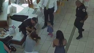 Surveillance video shows 2 officers saving choking baby [upl. by Einaffets]