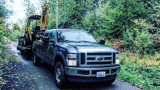 FORD F350 HAULING A CAT 416C BACKHOE ON BIG TEX TRAILER [upl. by Alegnad]