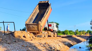 New rural road constructionHeavy dump truck Hyundai 25 ton unloading the soil so powerfully [upl. by Eulaliah]