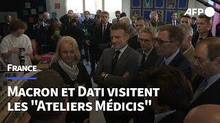 Macron et Dati visitent les quotAteliers Médicisquot lieu culturel en SeineSaintDenis  AFP Images [upl. by Darcey946]