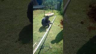 Bolting up the interlocking pole mounting structures for solar floodlights installation [upl. by Anoynek]