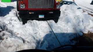 1980 GMC Brigadier being Pulled out of Snowwith Log Truck [upl. by Erdnoid]