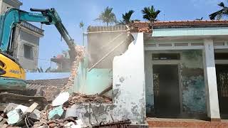 Excavator demolishing old house and cleaning up [upl. by Gibb]