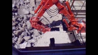 NPK B040 Pedestal Boom System  Breaking Oversized Rock at an Impact Crusher [upl. by Ashly]