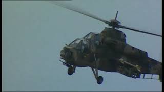 South African Rooivalk Attack Helicopter performing a loop and barrel roll at Airshow [upl. by Aihsoem821]