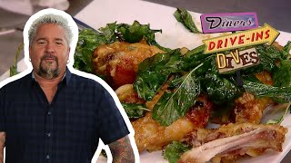 Guy Fieri Eats EXTRAGarlicky Spicy Thai Chicken Wings  Diners DriveIns and Dives  Food Network [upl. by Remos]