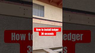 Installing wood ledger at stucco home construction framing deckbuilding [upl. by Htrow]