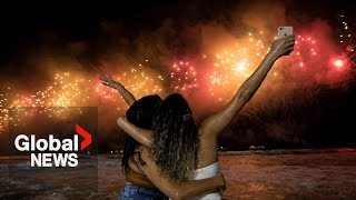 New Years 2023 Copacabana beach sizzles in Rio de Janeiro as fireworks illuminate night sky [upl. by Eidoow]