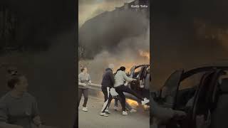 WHOA Good Samaritans save driver from burning car [upl. by Brunella]