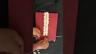 How to tie jasmine flowers closly in easy waydifferent method to string jasmine flowersmallipoo [upl. by Asiat]