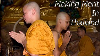 Making Merit And Presenting Robes To Monks In Thailand [upl. by Nishom]