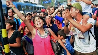 Europe migrant crisis chaos and confusion in Budapests main railway station [upl. by Erdnassak]