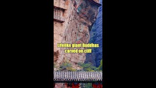 Lifelike giant Buddhas carved on cliff in Chinas Gansu [upl. by Niraj]