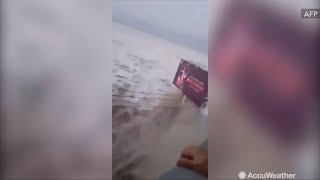 Terrifying footage shows tsunami crash into island of Palu in Indonesia [upl. by Ise960]