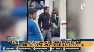 OFF Bajan llanta de grúa para evitar que se lleve un auto en San Isidro [upl. by Atilemrac]