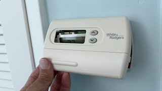 How to remove the cover on a White and Rodgers thermostat [upl. by Etakyram514]