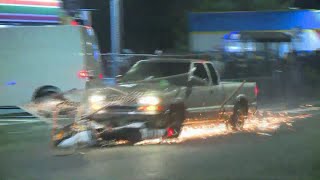 Pickup plows through protester crowd drags motorcycle [upl. by Akirre199]