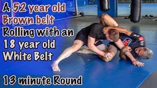 A 52 year old Brown belt rolling with an 18 year old White belt [upl. by Aneelahs307]