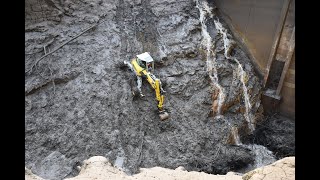 Menzi Muck M545 digging out a reservoir in Switzerland on a extrem steep slope [upl. by Towill]