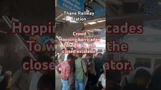 Crowd hopping barricades to walk up closed escalator mumbaisubarban thanerailwaystation [upl. by Gilchrist904]