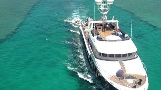 SuperYacht Special Ice 5 navigates narrow channel Epic aerial shots [upl. by Sydelle562]