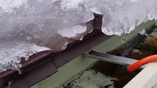 Putting gutter heat cable to keep ice from building up [upl. by Alie896]