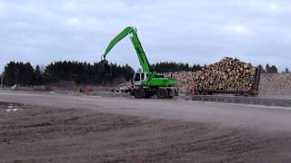 SENNEBOGEN  Timber Handling 830 Mobile Trailer Machine at Sawmill [upl. by Sulakcin509]