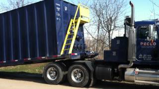 Peterbilt Winch Truck Picking up Frac Tank [upl. by Retrac]