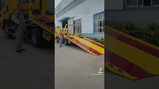 Sinotruk Howo Flatbed Tow truck amp wrecker rescue tractor winch cranetruck [upl. by Nomzed]