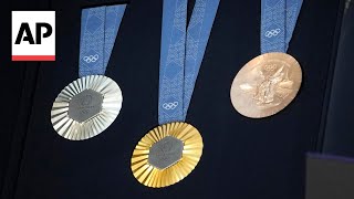 The Paris Olympics medals are monumental Theyre made with metal chunks from the Eiffel Tower [upl. by Ahsieket332]