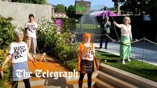 Woman hoses down Just Stop Oil protesters at Chelsea Flower Show [upl. by Painter928]