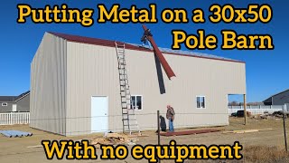 Putting Metal on a 30x50 Pole Barn [upl. by Ardekal44]